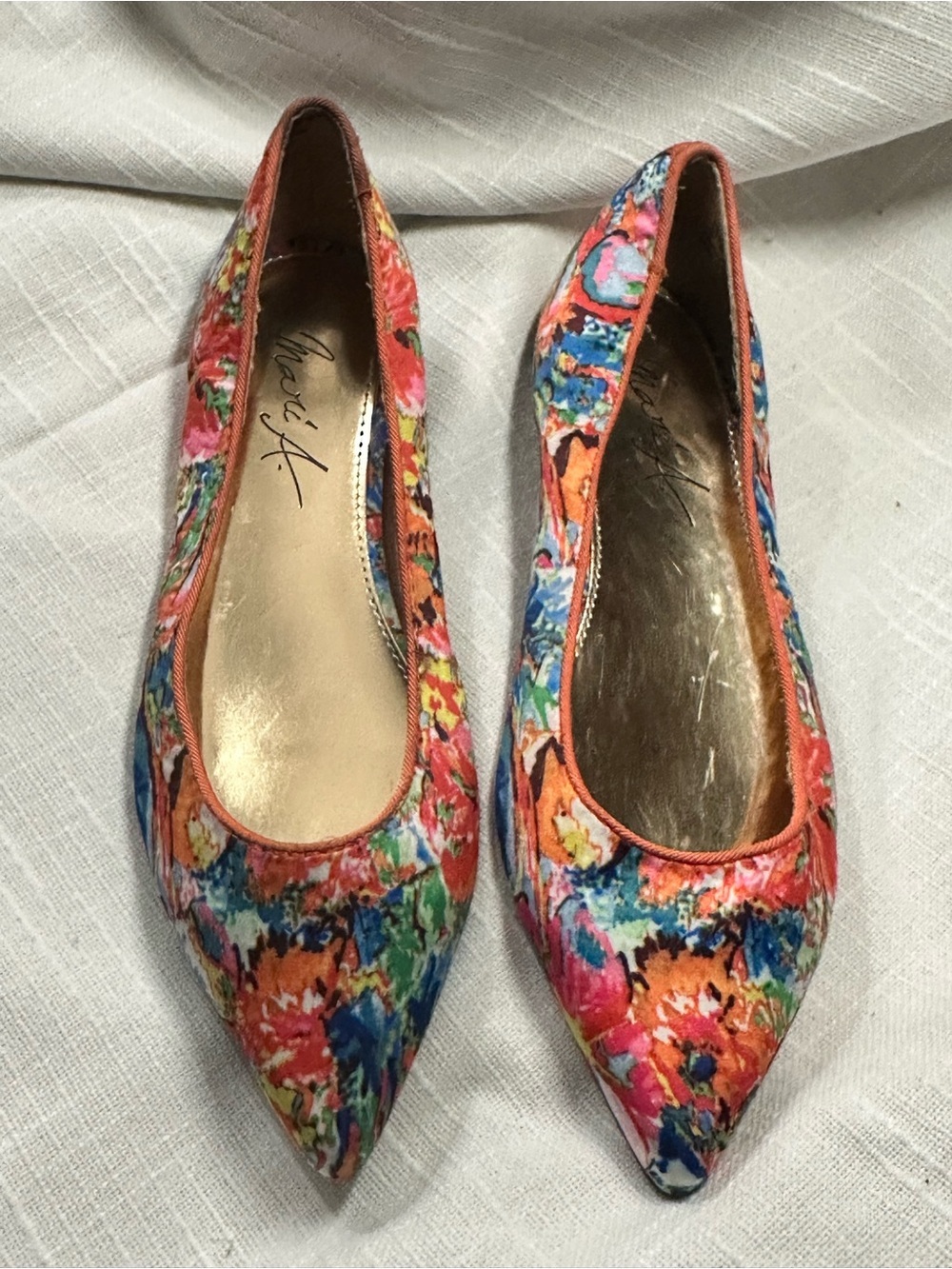 Mari A sateen ballet flats featuring a vibrant multicolored floral print